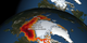 Print resolution still:  top globe shows 1979 September sea ice cover; bottom globe shows 2012 September sea ice cover with albedo change overlaid using a red color bar.  Versions are provided with and without labels.