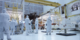 4K B-roll footage of  the Webb Telescope structure being moved from the assembly stand to the rollover fixture inside the cleanroom.