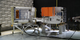 Time-lapse of the NICER payload returning to its stowed configuration after electromagnetic testing on Feb. 3, 2016, at NASA's Goddard Space Flight Center.  The time-lapse video opens with NICER in its fully deployed configuration. In this configuration, the FRAM plate is on the left, the X-ray Timing Instrument (XTI) “box” on the right and the Deploy and Pointing System (DAPS) boom connects the two horizontally across the middle of the frame.   While the DAPS is responsible for swinging the XTI swiftly from target to target across the sky, it can only do so in the weightless environment on orbit, not in Earth’s gravity on the ground. Stowing and deploying tests must therefore be conducted with the payload lying on its side and the weight of the moving parts supported by a structure on wheels.
