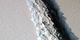 As of Nov., 2016, the rift in Larsen C was about 300 feet wide and about a third of a mile deep. 